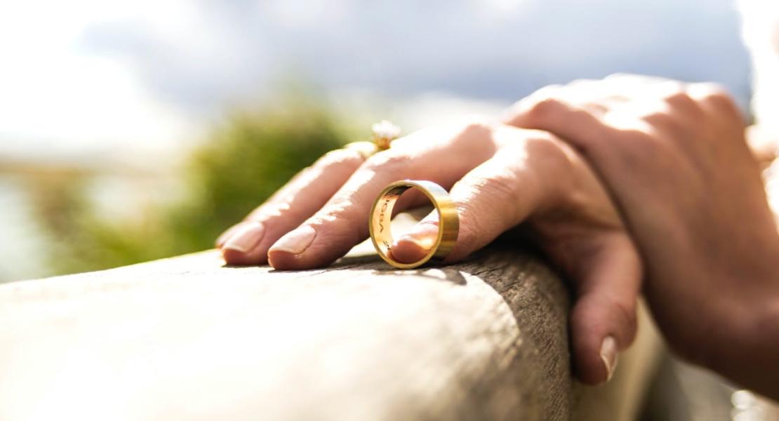 Hand with wedding ring coming off Hand with wedding ring coming off