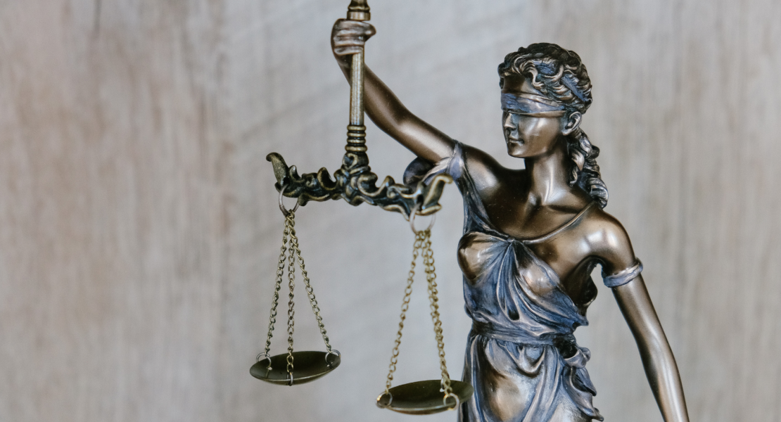 Lady justice holder scales blind folded Lady justice holder scales blind folded