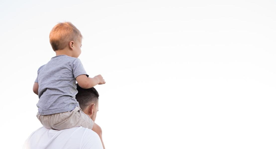 Parent with child on shoulders Parent with child on shoulders